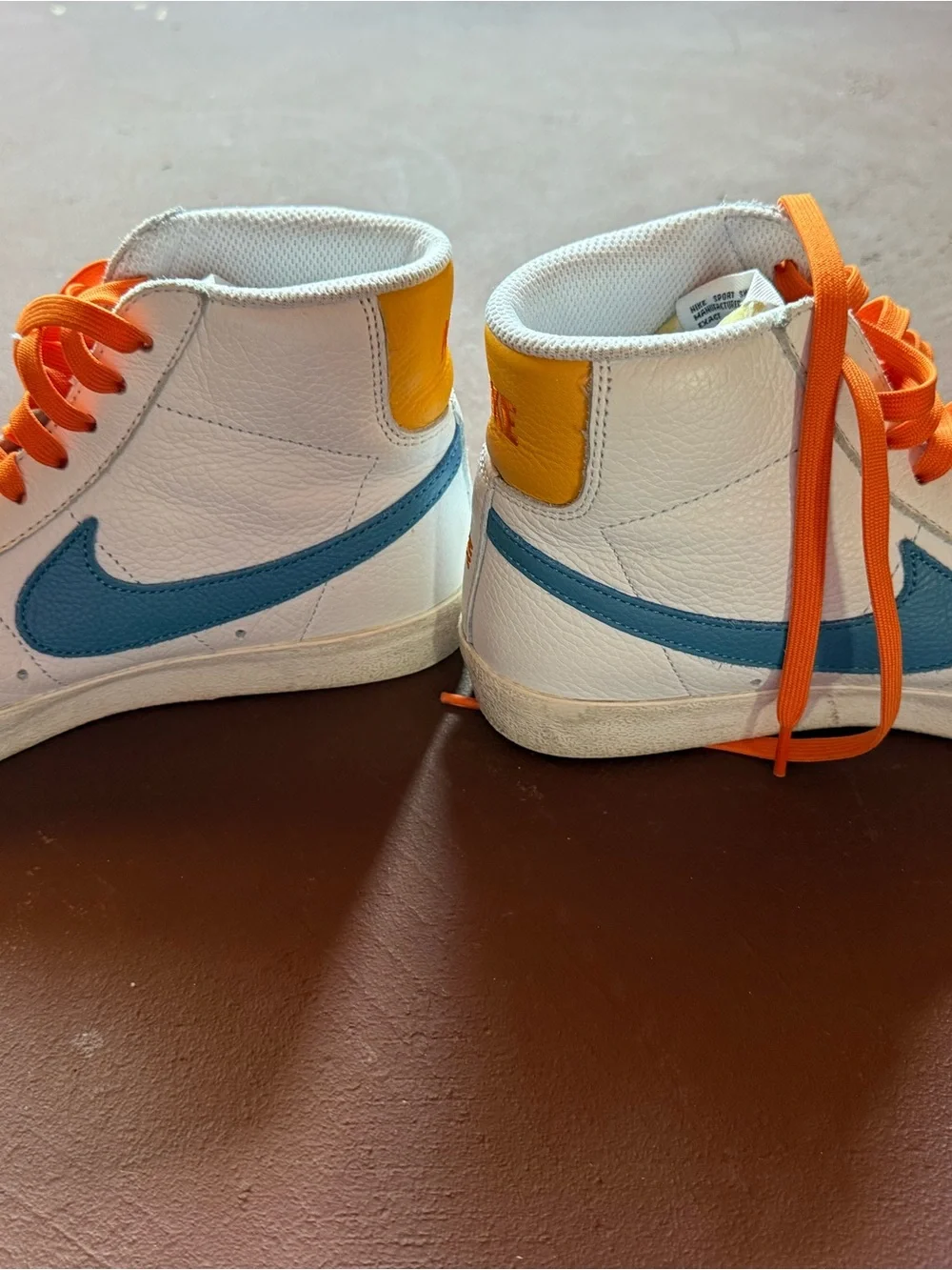 Custom Nike White High-Top Sneakers with Orange Laces and Blue Swoosh